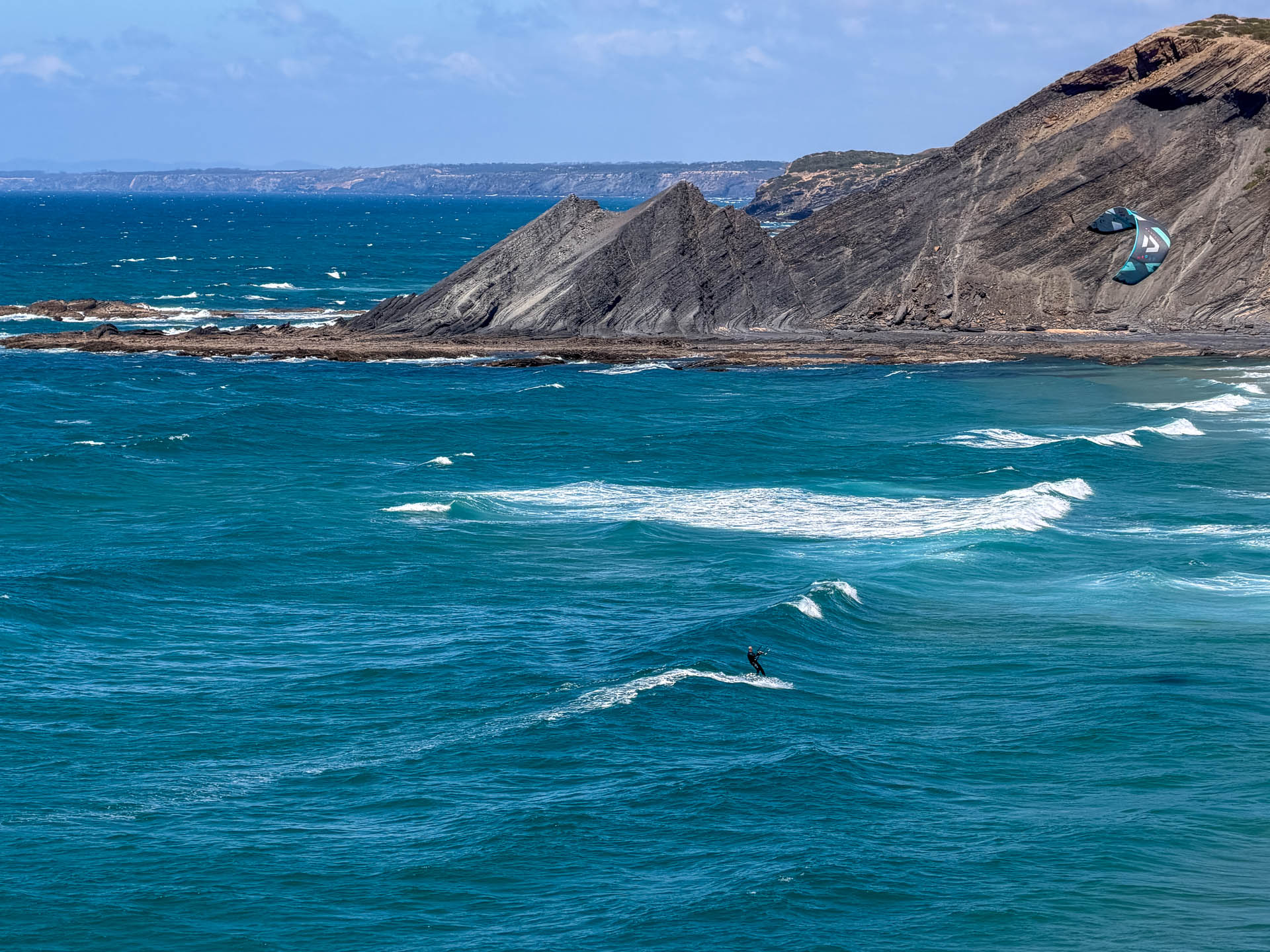 Kitesurfer aerial shot Algarve coast Portugal